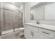 Bright bathroom with white vanity, shower stall with glass door, and tile flooring at 232 E Warfield Dr, Mooresville, NC 28115