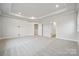 Large bedroom with tray ceiling and plush carpet at 232 E Warfield Dr, Mooresville, NC 28115