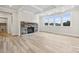 Open concept living room features coffered ceiling, fireplace and lots of light at 232 E Warfield Dr, Mooresville, NC 28115