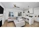 Modern kitchen with island, white cabinets, and hardwood floors at 607 Mattie Rose Ln, Charlotte, NC 28204