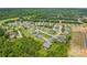 Aerial view of a neighborhood surrounded by lush trees and greenery at 1302 Devonmere Pl, Salisbury, NC 28144