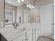 Bright bathroom with double sink vanity, decorative lighting, and a large mirror, perfect for your morning routine at 1302 Devonmere Pl, Salisbury, NC 28144