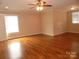 Large bedroom with hardwood floors and ceiling fan at 1302 Devonmere Pl, Salisbury, NC 28144