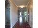 Bright hallway with hardwood floors and arched doorways at 1302 Devonmere Pl, Salisbury, NC 28144