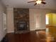 Living room features a stone fireplace and hardwood floors at 1302 Devonmere Pl, Salisbury, NC 28144