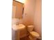 Cozy powder room with pedestal sink and neutral tones at 1302 Devonmere Pl, Salisbury, NC 28144