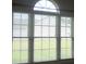 Large window with white blinds overlooking a green lawn at 1302 Devonmere Pl, Salisbury, NC 28144