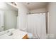 Simple bathroom with shower, toilet and vanity at 4816 Windchase Ln, Charlotte, NC 28269