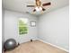 Simple bedroom with a large window and ceiling fan at 4816 Windchase Ln, Charlotte, NC 28269