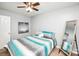 Bedroom with a bed, mirror, and teal bedding at 4816 Windchase Ln, Charlotte, NC 28269