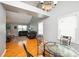 Open concept dining area with hardwood floors and a view of the living room at 4816 Windchase Ln, Charlotte, NC 28269