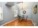 Dining area with hardwood floors, glass table, and four chairs at 4816 Windchase Ln, Charlotte, NC 28269