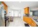 Kitchen with wood cabinets, granite countertops, and stainless steel appliances at 4816 Windchase Ln, Charlotte, NC 28269