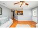 Living room with a view of the kitchen and access to back door at 4816 Windchase Ln, Charlotte, NC 28269