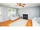 Living room with fireplace, hardwood floors and neutral colored couch at 4816 Windchase Ln, Charlotte, NC 28269