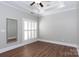 Light-filled bedroom with hardwood floors and plantation shutters at 3203 Kelsey Plz, Kannapolis, NC 28081