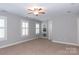 Spacious bedroom with neutral walls, carpet, window shutters, and built-in shelving at 3203 Kelsey Plz, Kannapolis, NC 28081