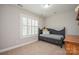 Charming bedroom with daybed and window shutters at 3203 Kelsey Plz, Kannapolis, NC 28081