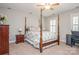 Large bedroom with wood post bed and ceiling fan at 3203 Kelsey Plz, Kannapolis, NC 28081