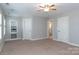 Bright bedroom with carpet flooring, ceiling fan, and access to a full bathroom at 3203 Kelsey Plz, Kannapolis, NC 28081