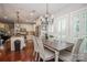 Farmhouse style dining room with wood table and white chairs at 3203 Kelsey Plz, Kannapolis, NC 28081