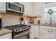 Stainless steel appliances and granite countertops in kitchen at 3203 Kelsey Plz, Kannapolis, NC 28081