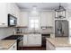 Granite countertops and stainless steel appliances in this kitchen at 3203 Kelsey Plz, Kannapolis, NC 28081