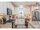 Kitchen features granite countertops, stainless steel appliances, and white cabinets at 3203 Kelsey Plz, Kannapolis, NC 28081
