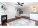 Spacious living room with hardwood floors, fireplace, and staircase at 3203 Kelsey Plz, Kannapolis, NC 28081