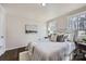 Cozy bedroom features natural light, hardwood floors, neutral paint, and stylish decor at 3210 Marlborough Rd, Charlotte, NC 28208