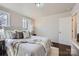 Well-lit bedroom with a bed and a window that provides a view of the outside at 3210 Marlborough Rd, Charlotte, NC 28208