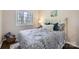 Bright bedroom with a large window, comfortable bed, and natural light at 3210 Marlborough Rd, Charlotte, NC 28208