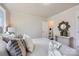 Spacious bedroom with hardwood floors, neutral wall paint, and a comfortable bed at 3210 Marlborough Rd, Charlotte, NC 28208