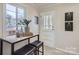 Eat-in dining area featuring natural light and seating for two. Neutral paint throughout at 3210 Marlborough Rd, Charlotte, NC 28208