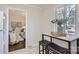 Eat-in dining area featuring natural light and seating for two. Cozy view into the living room at 3210 Marlborough Rd, Charlotte, NC 28208