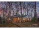 Charming brick home with a well-maintained lawn and mature trees providing shade and curb appeal at 3210 Marlborough Rd, Charlotte, NC 28208