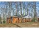 Charming brick home with a well-maintained lawn and mature trees providing shade and curb appeal at 3210 Marlborough Rd, Charlotte, NC 28208
