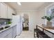 Well-lit kitchen featuring eat-in breakfast bar, stainless steel appliances, and an open floor plan at 3210 Marlborough Rd, Charlotte, NC 28208