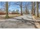 Residential street featuring tree-lined sidewalks and charming single-Gathering homes at 3210 Marlborough Rd, Charlotte, NC 28208