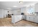 Modern kitchen with white cabinets, granite countertops, and stainless steel appliances at 927 Happy Plains Rd, Taylorsville, NC 28681