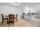 Kitchen with island, stainless steel appliances, and dining area at 927 Happy Plains Rd, Taylorsville, NC 28681