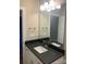 Modern bathroom with dark countertop and double vanity at 118 Abbington Ln, Shelby, NC 28150