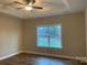 Spacious bedroom with hardwood floors, large window, and ceiling fan at 118 Abbington Ln, Shelby, NC 28150