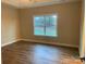 Bright bedroom with hardwood floors and a large window at 118 Abbington Ln, Shelby, NC 28150