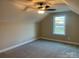 Charming bedroom with a window, ceiling fan and carpet at 118 Abbington Ln, Shelby, NC 28150