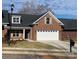 Two-car garage and front yard of brick home at 118 Abbington Ln, Shelby, NC 28150