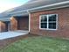 Brick home exterior with white window and landscaping at 120 Abbington Ln, Shelby, NC 28150