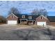 Brick duplex with two-car garages and landscaped yards at 120 Abbington Ln, Shelby, NC 28150