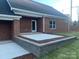 Brick home exterior with patio and landscaping at 120 Abbington Ln, Shelby, NC 28150