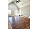 Spacious living area with vaulted ceiling, hardwood floors, and a large window at - Beltline Rd # 10, Chester, SC 29706